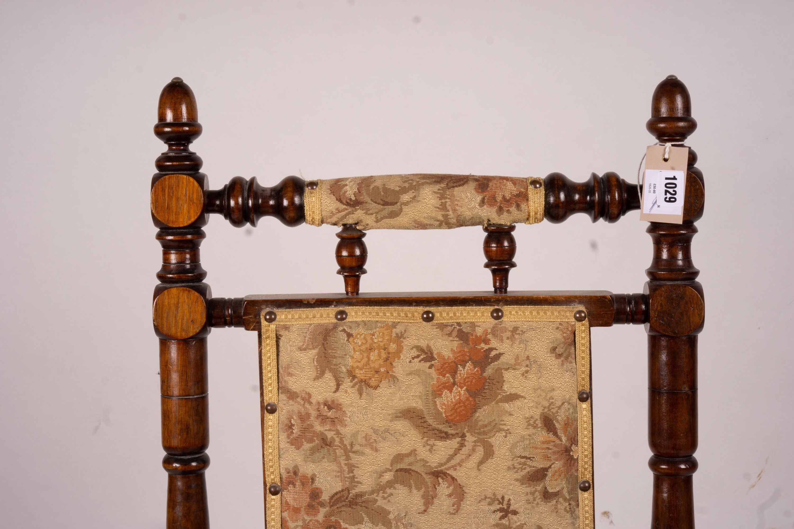 An early 20th century American turned mahogany rocking chair